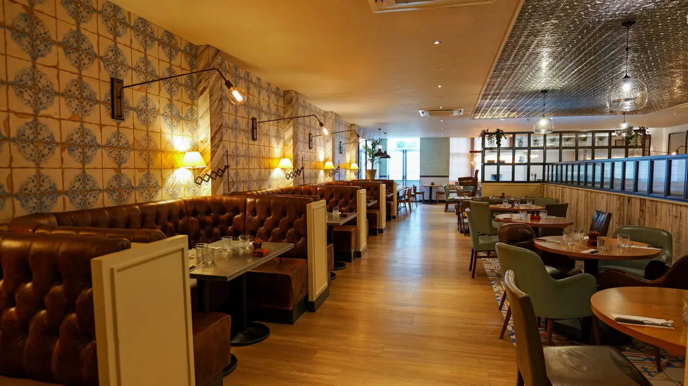 Inside Wildwood Crawley family restaurant featuring comfortable booth seating and dining tables for lunch or dinner.