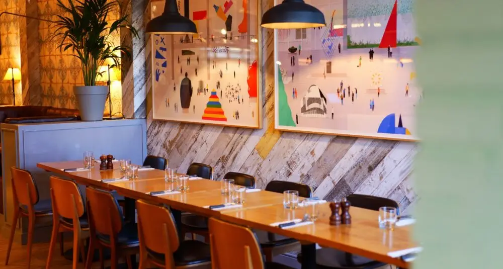 Wildwood Restaurants table with wooden chairs and tables with cutlery and glasses