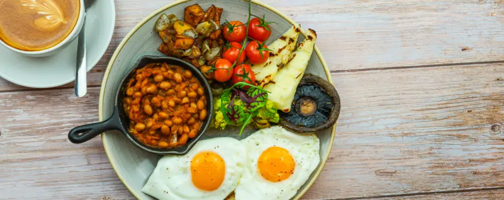 Vegetarian breakfast menu options and morning brunch meal at Wildwood pizza pasta grill, featuring fried eggs, grilled halloumi, and hot coffee