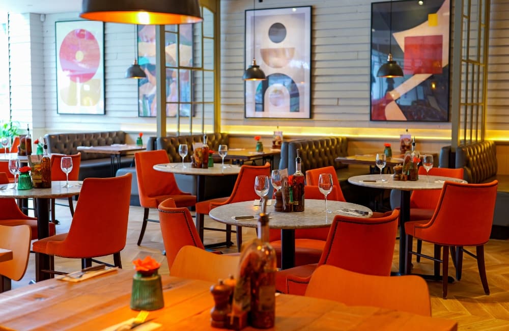 Main restaurant dining room layout and table arrangements at Wildwood Camberley pizza pasta grill, featuring comfortable booth seating for families or date nights.
