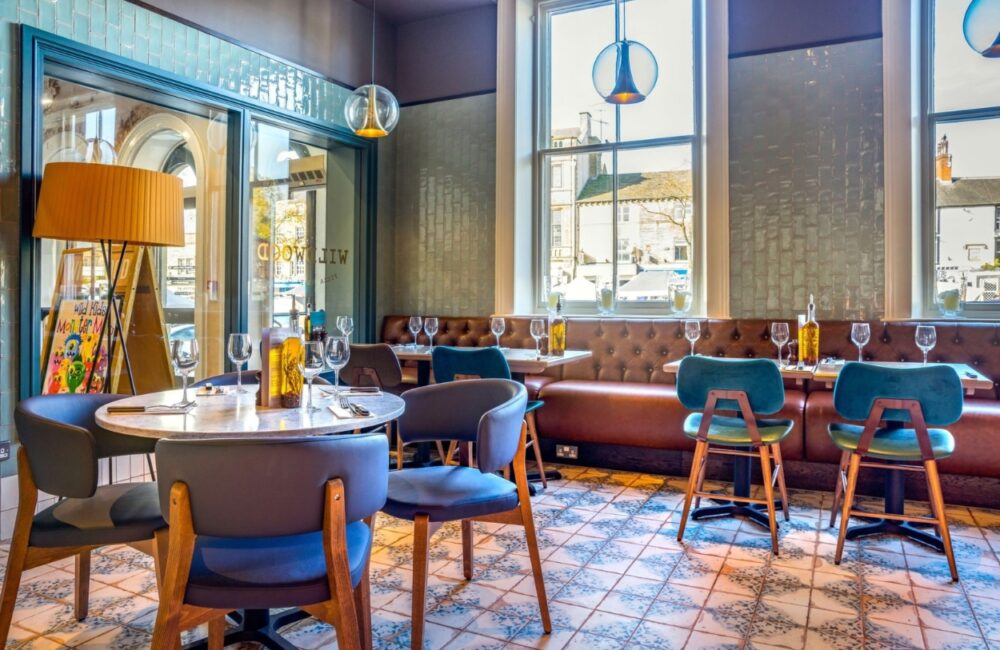 The contemporary indoor dining room and table arrangements at Wildwood restaurant in Taunton.